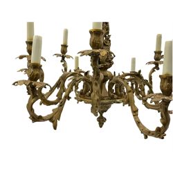 Mid-to-late 20th century gilt metal chandelier, on scrolled leaf and berry stem with twelve projecting serpentine leaf moulded branches