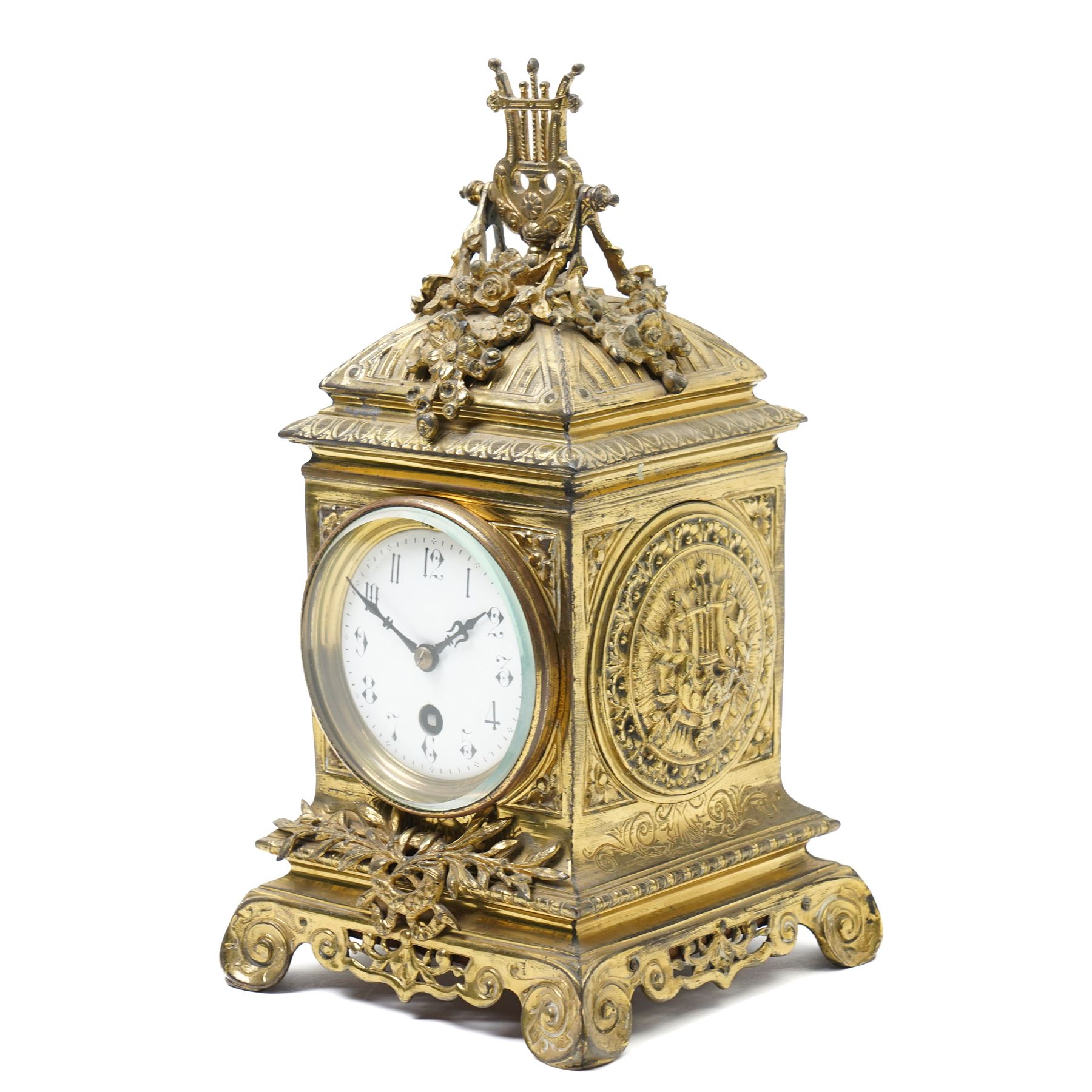 Early 20th century mantel clock with white enamel dial, French timepiece movement and recoil anchor escapement in brass case with lyre finial, trailing garlands and wreaths etc on scroll feet H30cm 
Provenance: property of a Nobleman