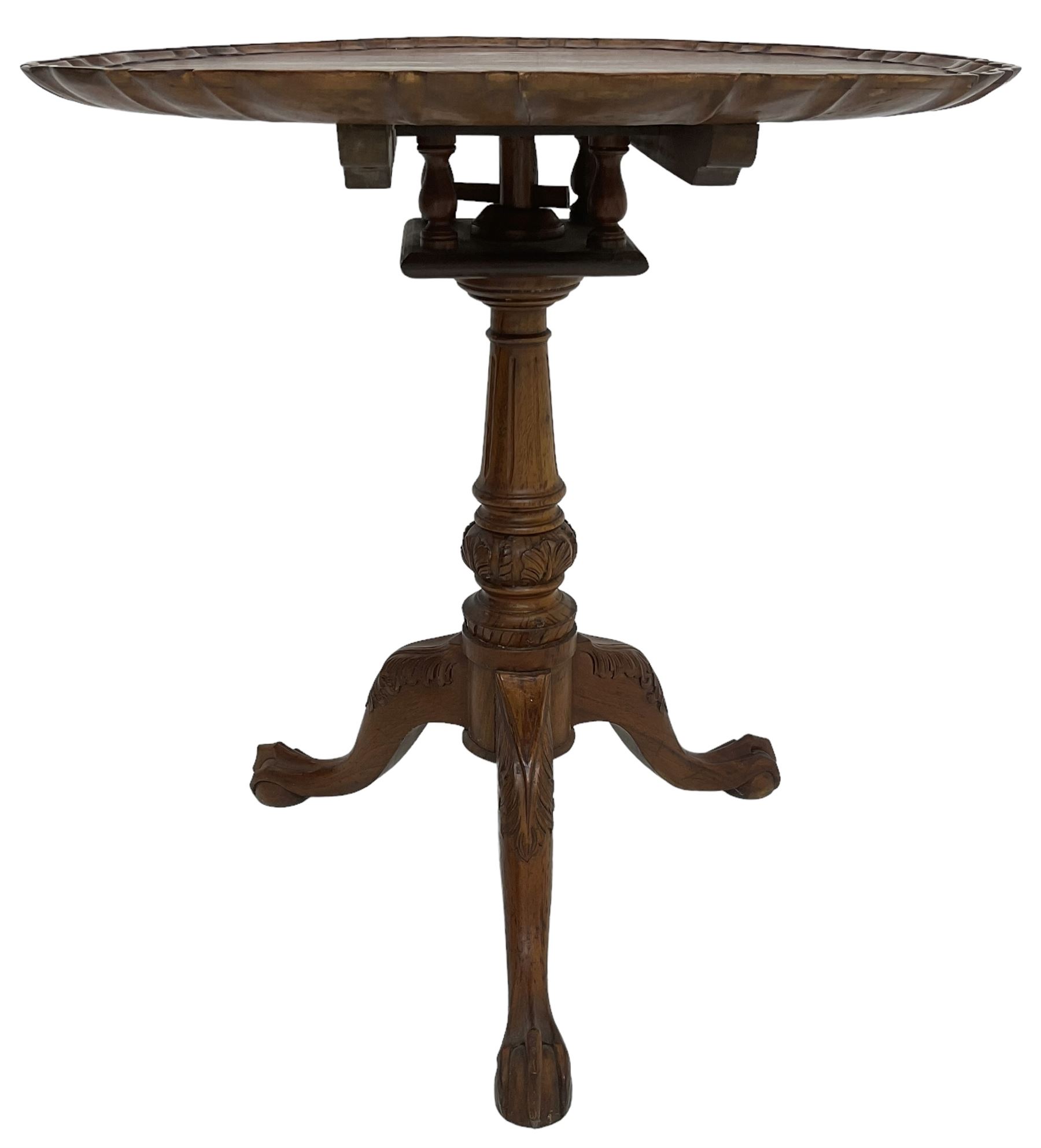 Georgian design hardwood tripod table, moulded pie-crust tilt-top, turned and fluted column carved with foliage, on three acanthus leaf carved splayed supports with ball and claw feet