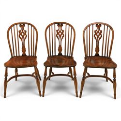 Set of six elm Windsor chairs, saddle seats with crinoline stretchers
