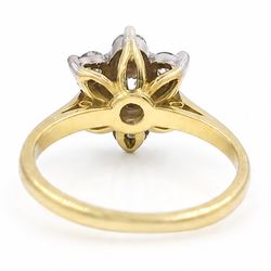 18ct gold diamond flower head cluster ring, principal round cut diamond of approx 0.55 carat, surrounded by six round brilliant cut diamonds, hallmarked, total diamond weight 1.15 carat