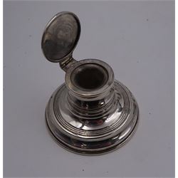 Group of early 20th century silver, to include a pair of specimen vases, of plain trumpet form, upon knopped stem and filled stepped circular foot, hallmarked J & R Griffin, Chester 1915, pair of silver mounted dwarf candlesticks, hallmarked J & R Griffin, Chester 1909, small silver mounted capstan inkwell with glass insert, hallmarked Chester 1909, maker's mark worn and indistinct, silver pepper, with pierced decoration, hallmarked S Blanckensee & Son Ltd, Birmingham 1909 and a similar mustard pot and cover, hallmarked S Blanckensee & Son Ltd, Chester 1909, both with blue glass liners