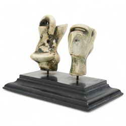 After Henry Moore (British 1898-1986): 'King and Queen', plaster maquette sculpture, base marked with affixed catalogue label inscribed 'King and Queen: 1952 Archive 0067285', W11cm H8cm
Notes: likely head studies for the large 'King and Queen' sculpture