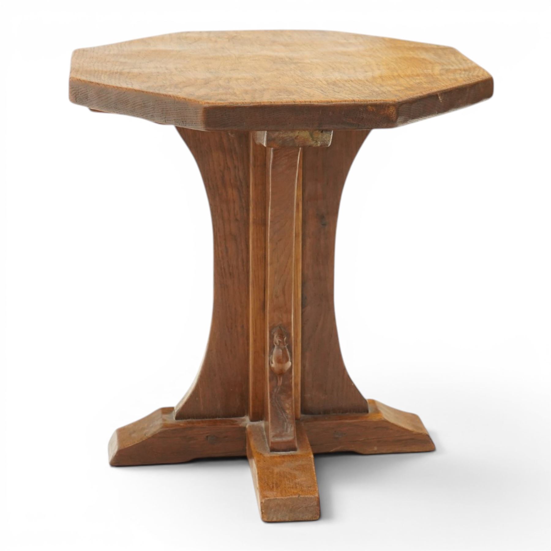 Mouseman - mid-20th century adzed oak coffee table of small proportions, the octagonal  adzed top raised on cruciform base and sledge feet, carved with mouse signature, by the workshop of Robert Thompson of Kilburn 