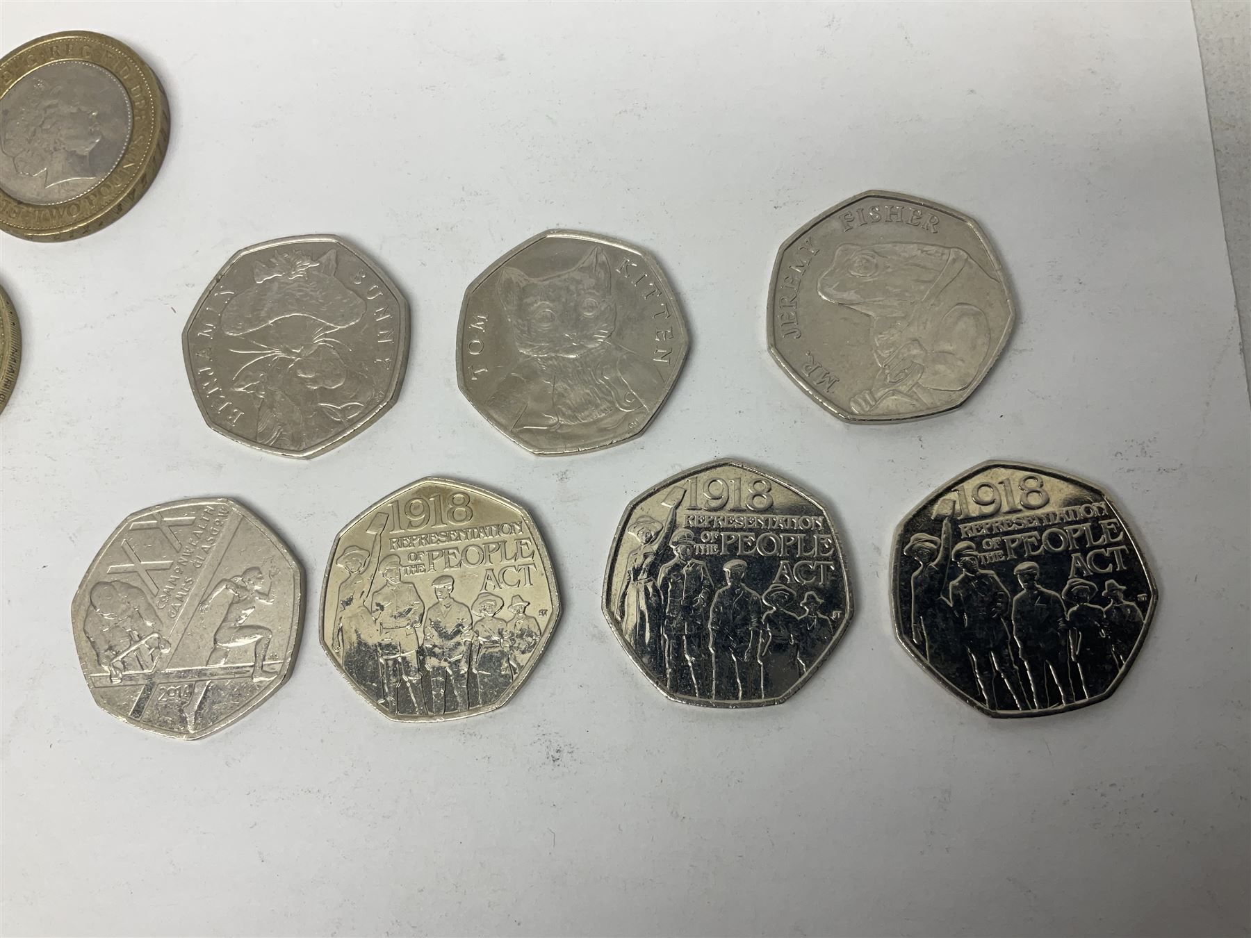 The Royal Mint United Kingdom mostly commemorative two pound, old round one pound and fifty pence coins, overall face value approximately 110 GBP, housed in three 'Coin Hunt' folders and loose