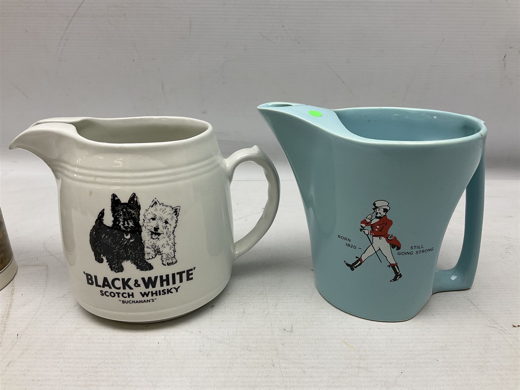 Six whisky water jugs, to include Wade Johnnie Walker, Haig, Black & White, etc