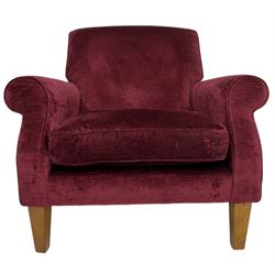 Duresta - traditional shape armchair upholstered in burgundy red velvet, on square tapering front supports (W88cm, H85cm, D103cm); together with a matching rectangular footstool with hinged seat, on turned feet with brass castors (73cm x 54cm, H38cm)