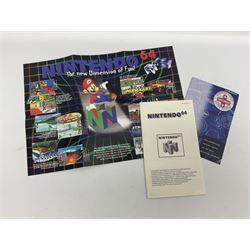Nintendo 64 console, two controllers, games and accessories. Accessories to include the ‘Tremorpak’ and ‘Spook’ 2 Phono plugs and a S-VHS plug with adapter, both in original boxes. Games to include ‘Golden Eye 007’, ‘Doom 64’, ‘Killer Instinct Gold’, ‘Tetrisphere’, ‘F-1 World Grand Prix’, ‘Pilotwings 64’ and ‘Lylatwars’ with ‘Rumble Pak’, all with original boxes and instruction manuals. ‘Star Wars Episode I Racer’ game cartridge in Shadows of the Empire box. 