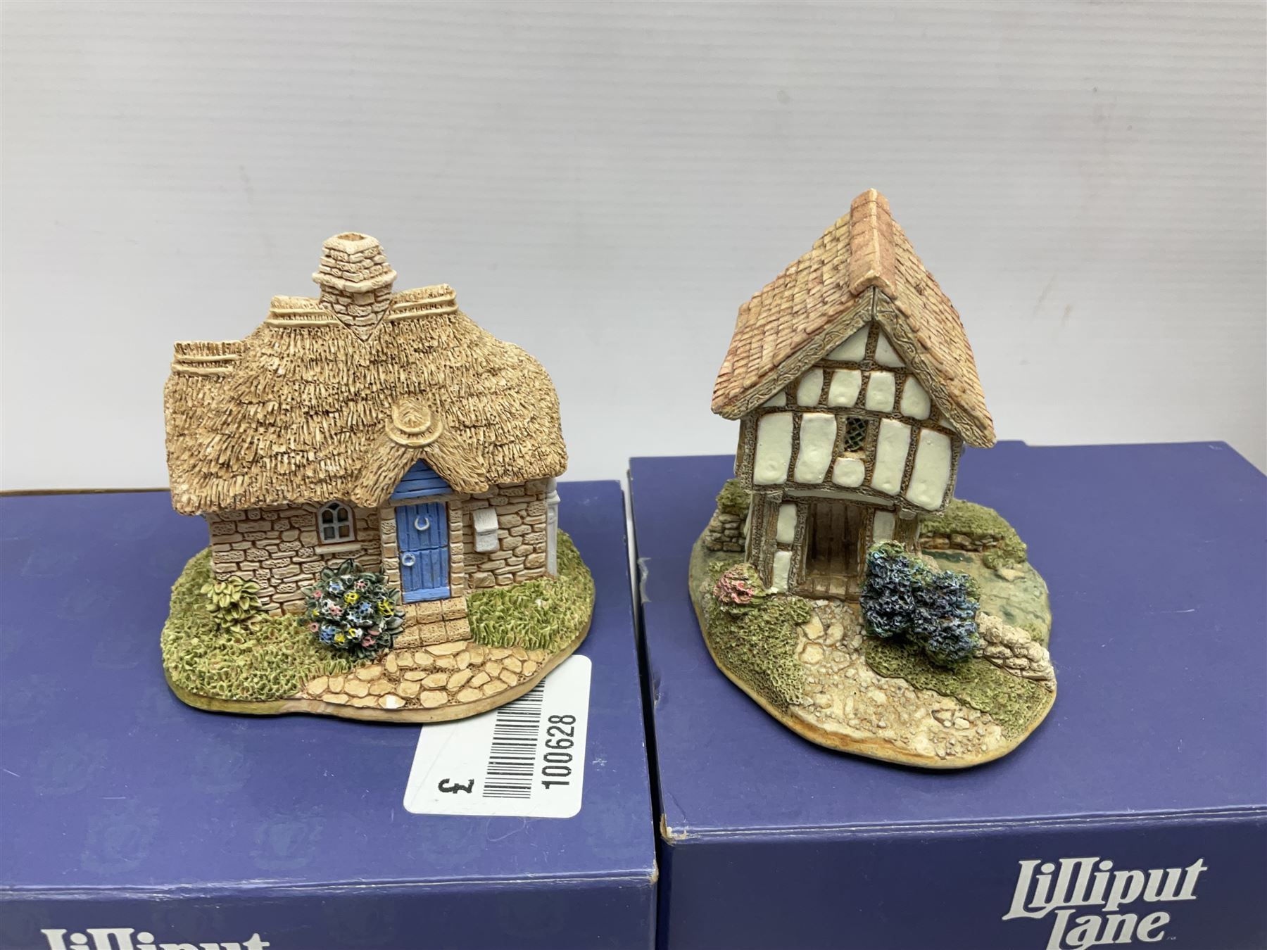 Oak cased mantel clock, two boxed Lilliput Lane cottages and two boxed tin-plate toys
