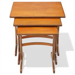 Victor Wilkins for G-Plan - 1970s teak 'Fresco' nest of three tables, rectangular top over vasiform end-supports with sledge feet, united by curved stretchers