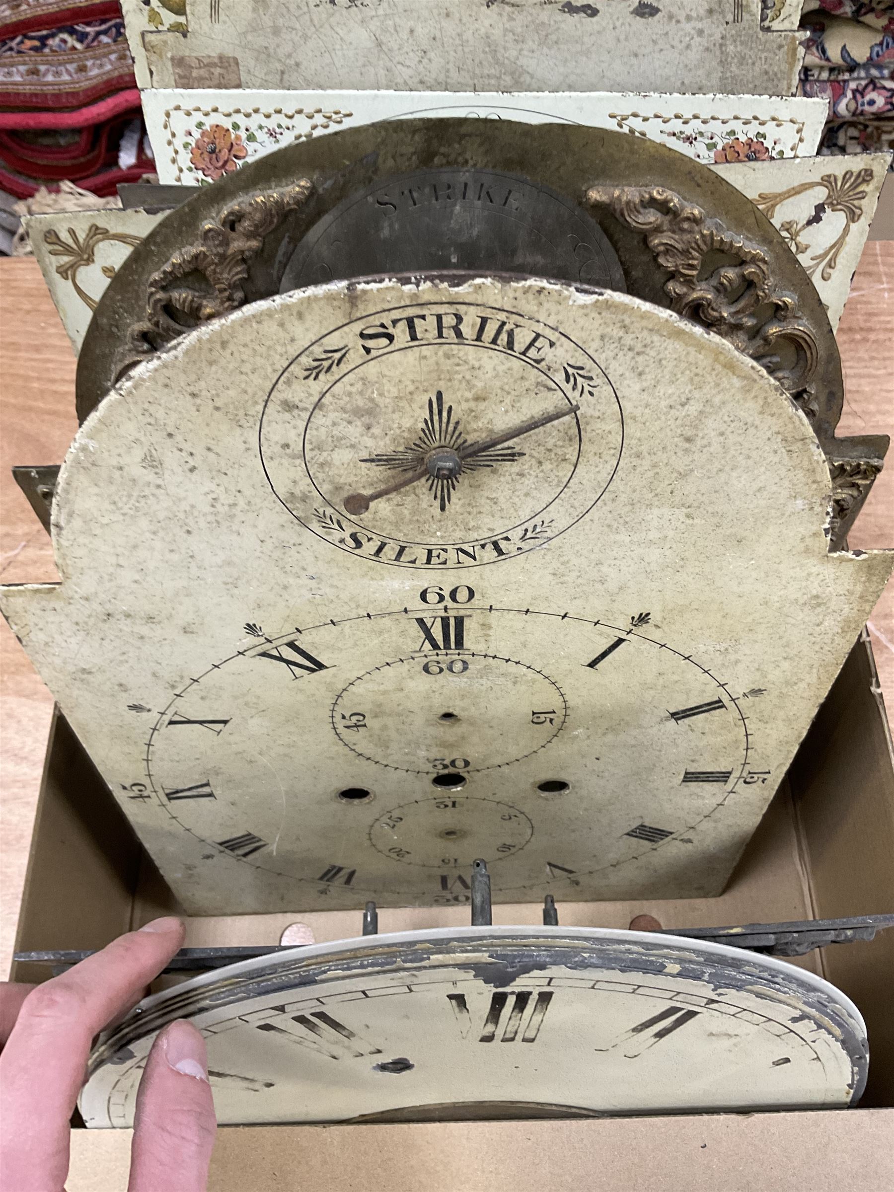 Approximately twenty-two longcase and wall clock dials, 18th century and later, included painted and brass examples