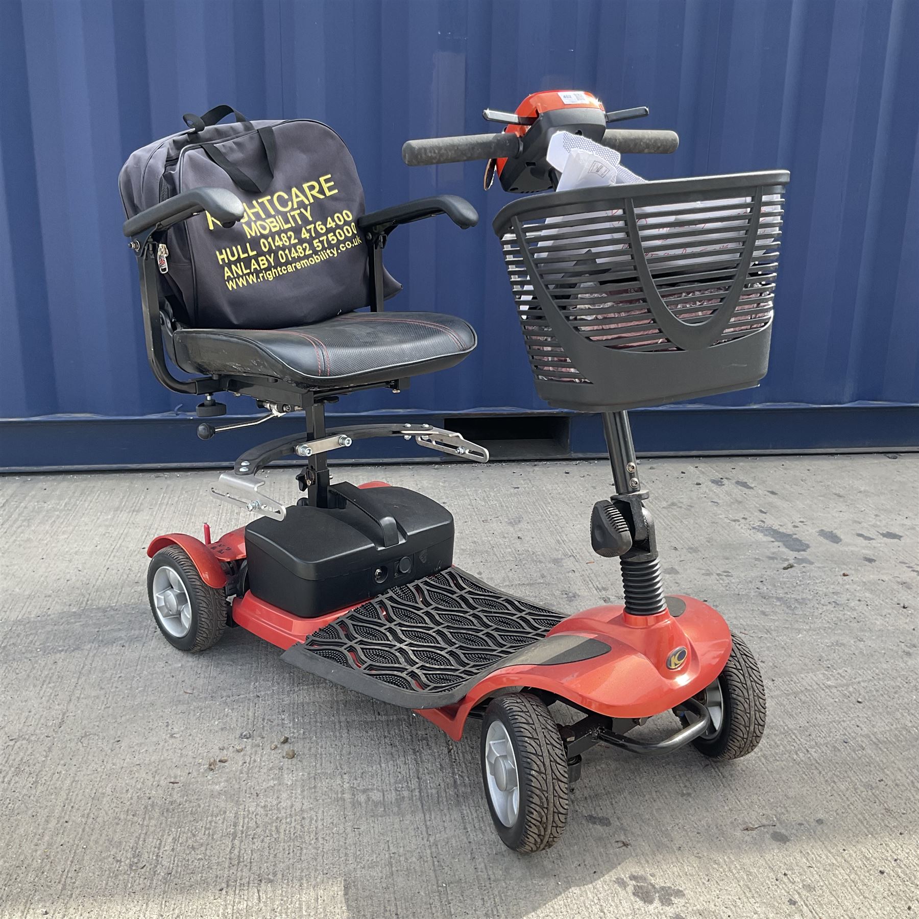 Four wheel electric mobility scooter in orange with keys and charger  - THIS LOT IS TO BE COLLECTED BY APPOINTMENT FROM DUGGLEBY STORAGE, GREAT HILL, EASTFIELD, SCARBOROUGH, YO11 3TX