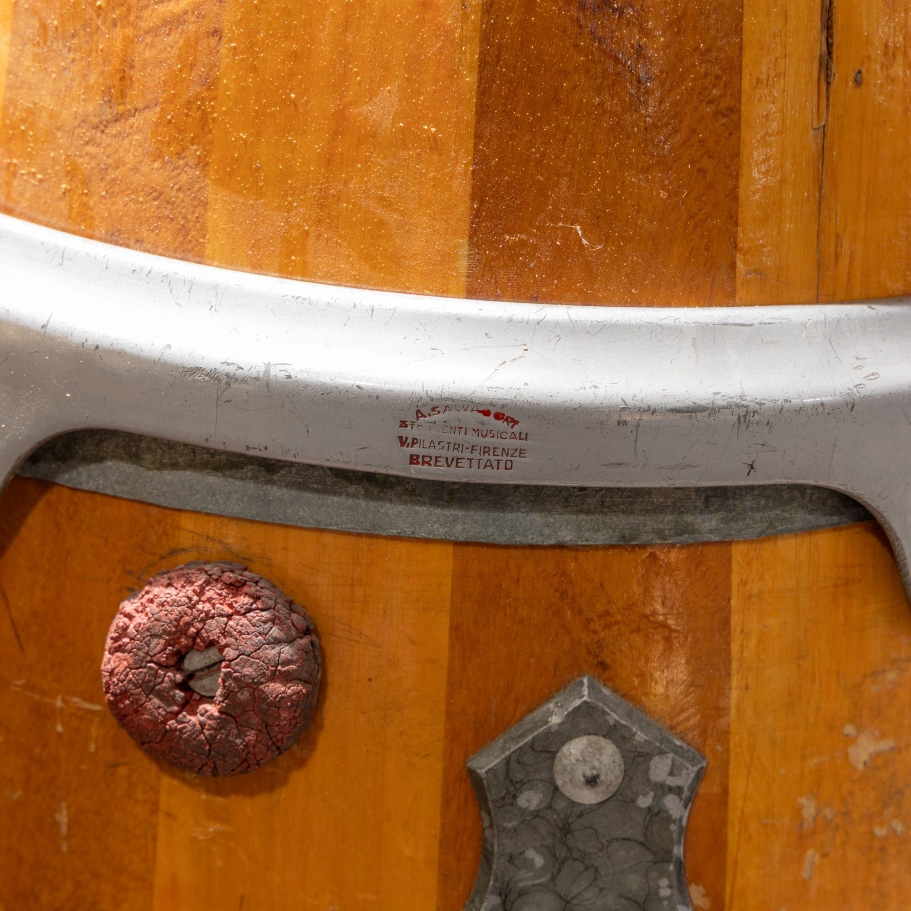 Three conga drums, comprising two Excelsior A. Salvadori Firenze stave-built wooden congas and one similar French example, with skin heads and metal tension mounts, on metal stands with hard carry cases for drums, tallest H79cm, D31cm