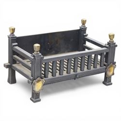 Arts and Crafts cast iron fire grate, rectangular backplate with plain upper rail over a s...