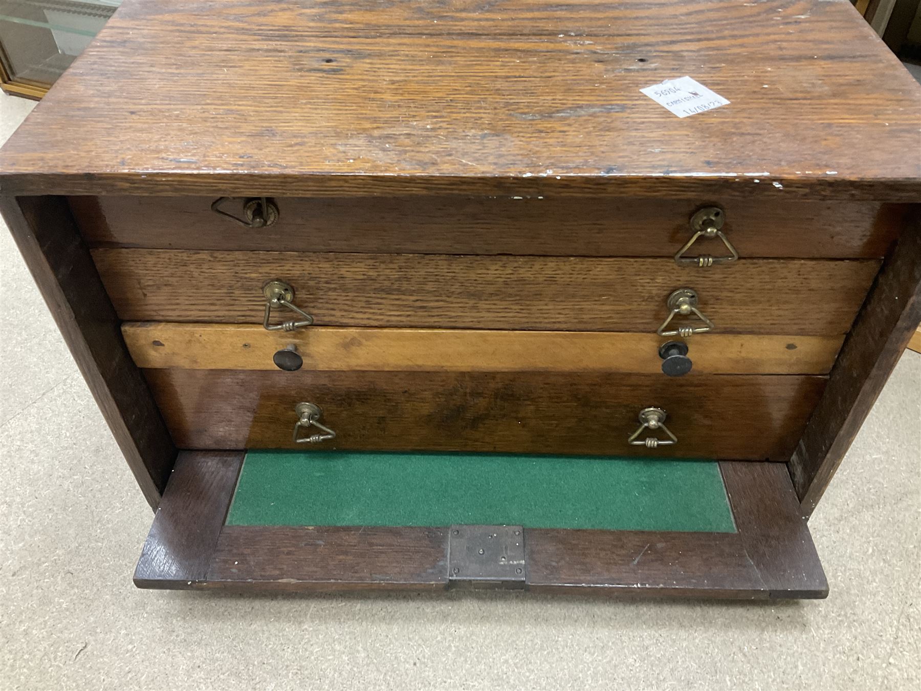 Six shelved cabinets for displaying ‘00’ gauge locomotives comprising plain plywood and white painted examples with track applied to various shelves, largest H63cm, W107cm, D27cm; Collection of tools for building model locomotives to include Weller PU-2D Soldering Pencil and Standard Tip Soldering Iron 20W/230V, Humbrol Modellers Airbrush, Power Supply Units and two wooden chests one of which housing a collection of tools including tweezers, scalping tools, wrenches etc 