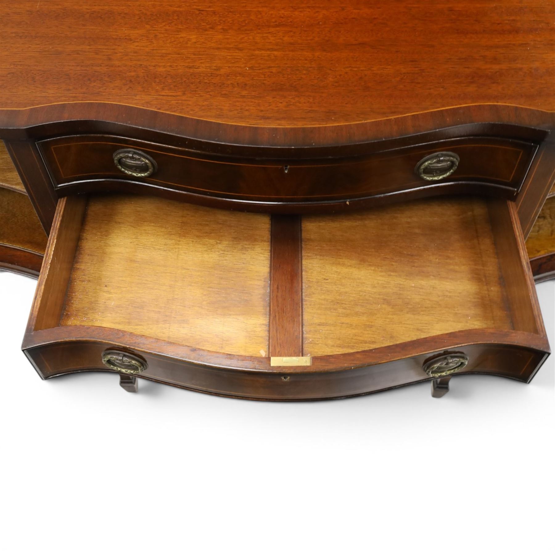 Georgian design mahogany serpentine sideboard, shaped top over two central drawers flanked by cupboard doors, flame mahogany veneered fronts with satinwood stringing, oval brass handles, shaped apron, on square tapering supports with spade feet
