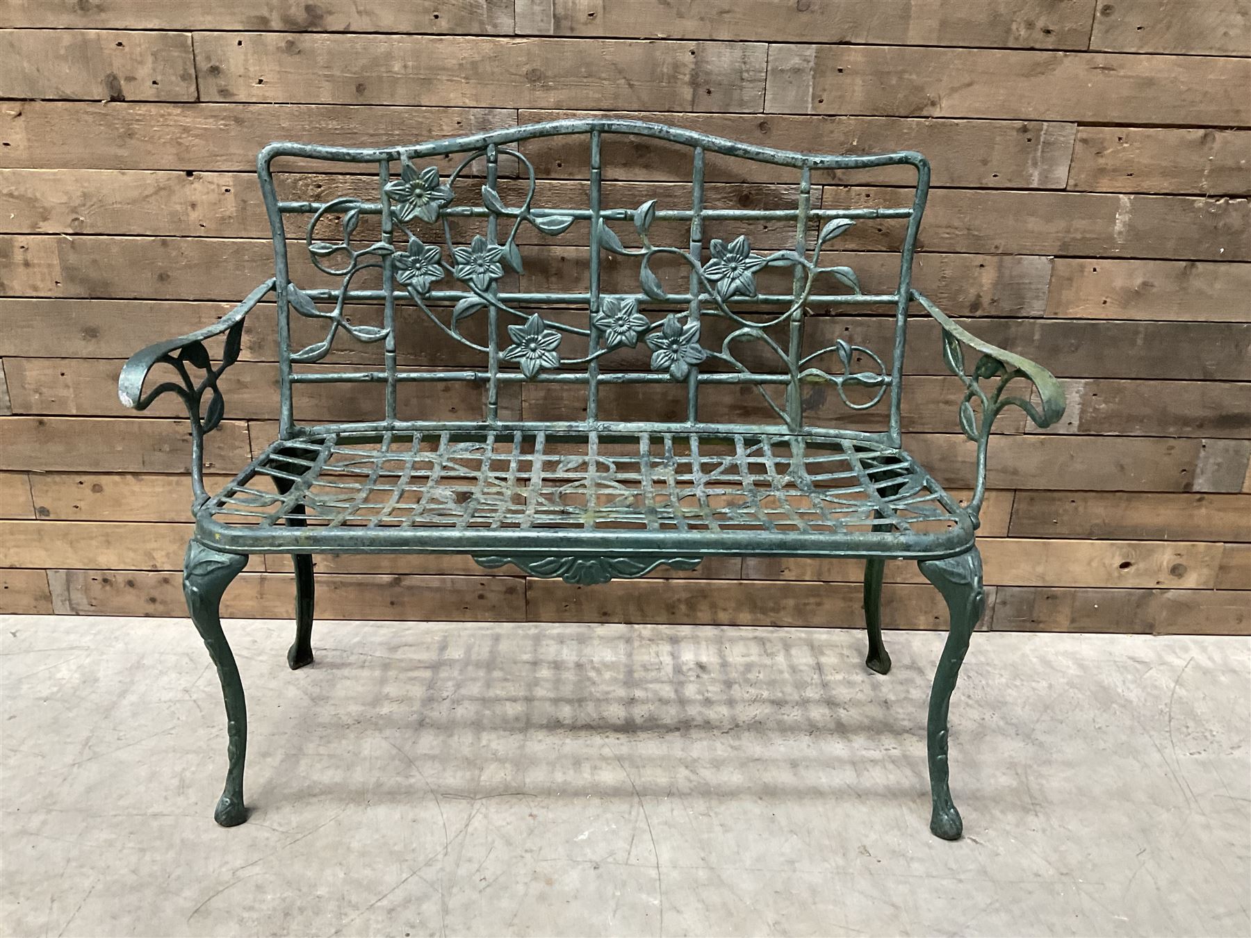 Cast aluminium garden dining set, comprising ornate circular table (D91cm, H68cm) a two seater bench, on cabriole supports (W118cm, H93cm, D55cm), and two matching armchairs (W55cm, H95cm, D54cm)
