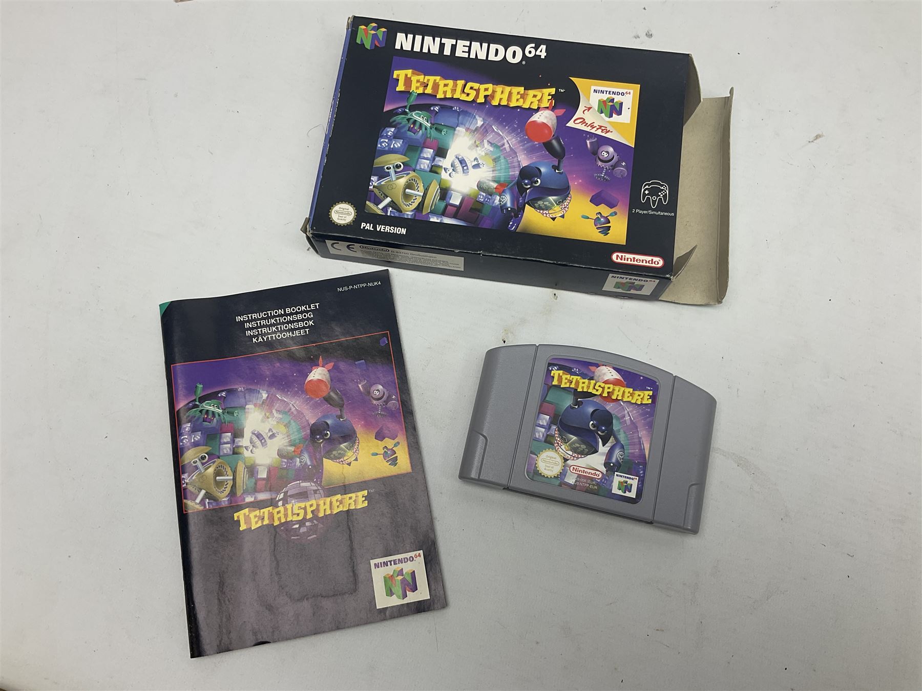 Nintendo 64 console, two controllers, games and accessories. Accessories to include the ‘Tremorpak’ and ‘Spook’ 2 Phono plugs and a S-VHS plug with adapter, both in original boxes. Games to include ‘Golden Eye 007’, ‘Doom 64’, ‘Killer Instinct Gold’, ‘Tetrisphere’, ‘F-1 World Grand Prix’, ‘Pilotwings 64’ and ‘Lylatwars’ with ‘Rumble Pak’, all with original boxes and instruction manuals. ‘Star Wars Episode I Racer’ game cartridge in Shadows of the Empire box. 
