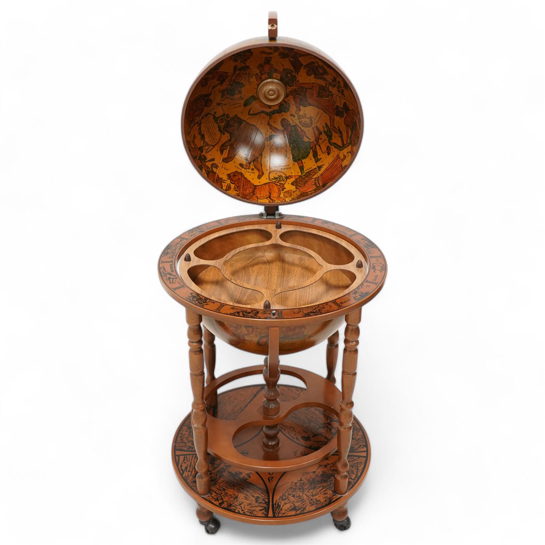 Late 20th century drinks globe, hinged lid enclosing drinks holders, on turned supports