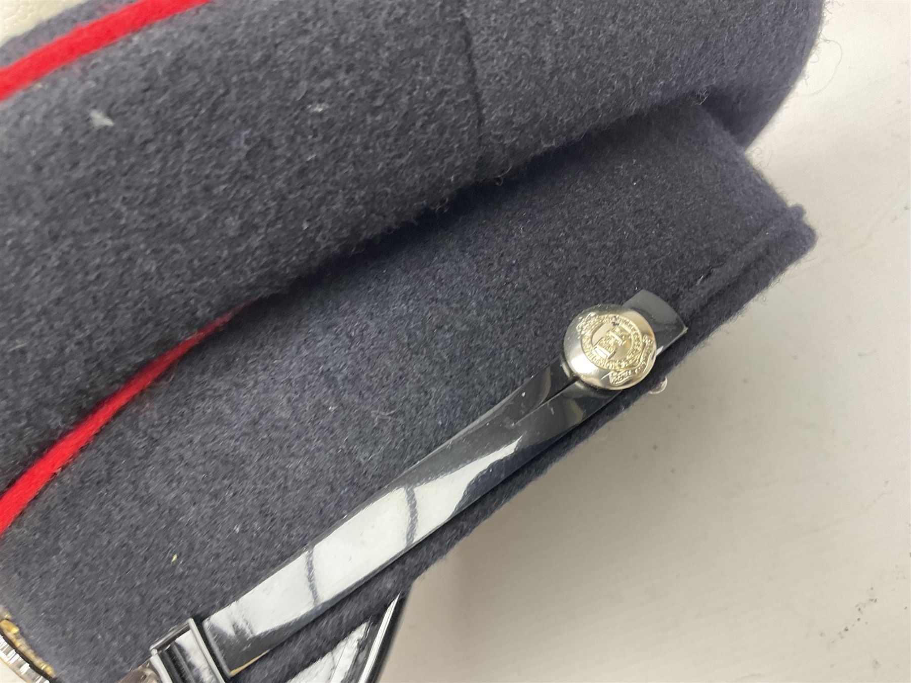 Five military caps/berets comprising two peaked caps with 'Yorkshire' and 'Royal Engineers' badges; maroon beret with parachute regiment badge; red beret with Military Police badge; and AB seaman hat with HM Submarines band; and a felt and webbing covered water bottle (6)