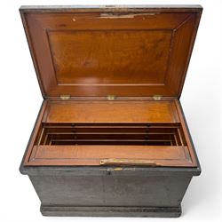 20th century black painted camphorwood lined tool chest, rectangular hinged lid over moulded edge, black painted exterior with iron straps and carry handles, the interior fitted with sliding lidded trays and drawers with turned handles, containing an assortment of hand tools