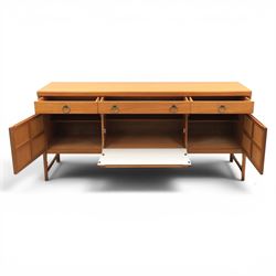 Nathan - 'Squares' mid 20th century teak sideboard, fitted with three drawers with brass ring handles, above a central fall front cabinet, flanked by two cupboard doors, raised on square tapering supports