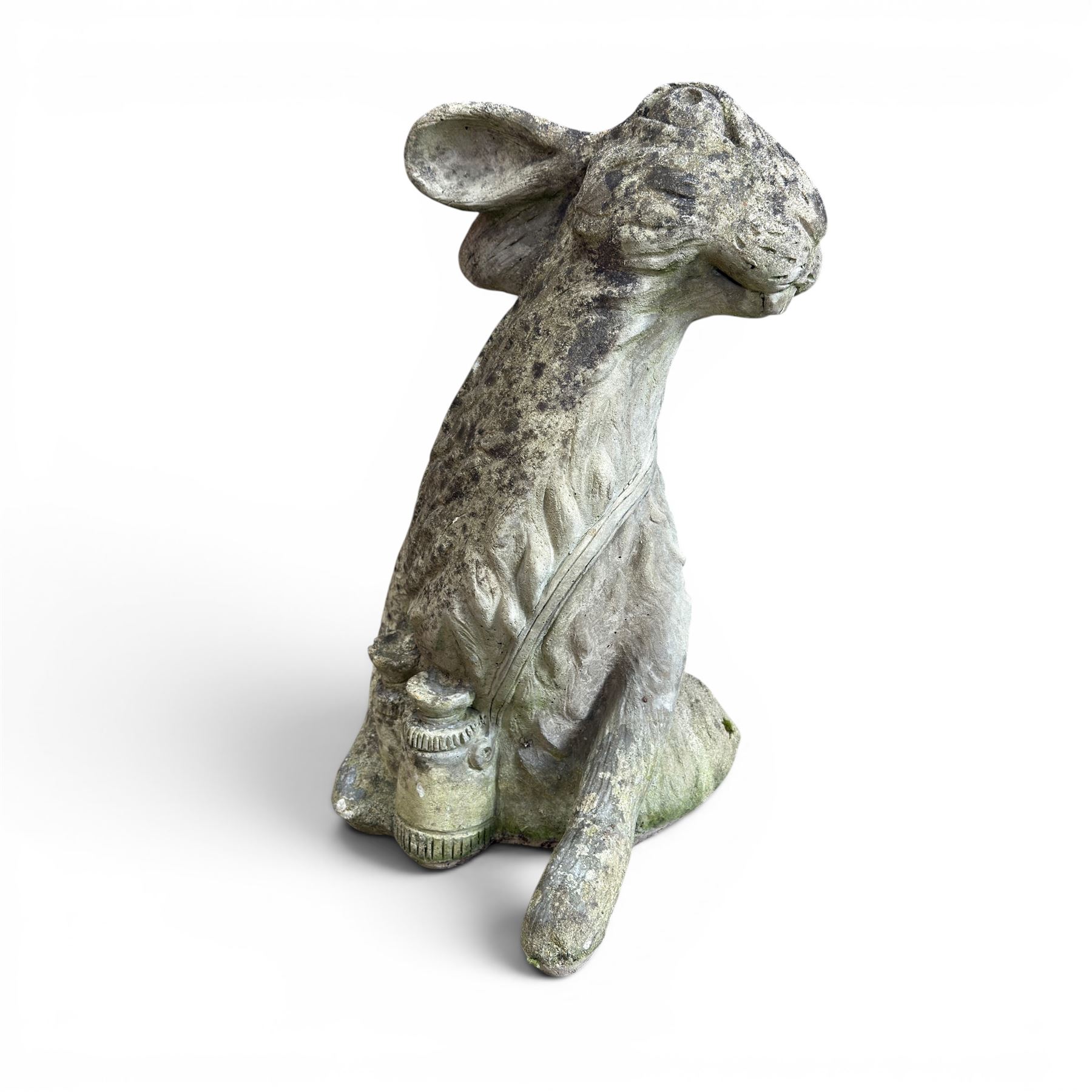 Two weathered cast stone garden hares
