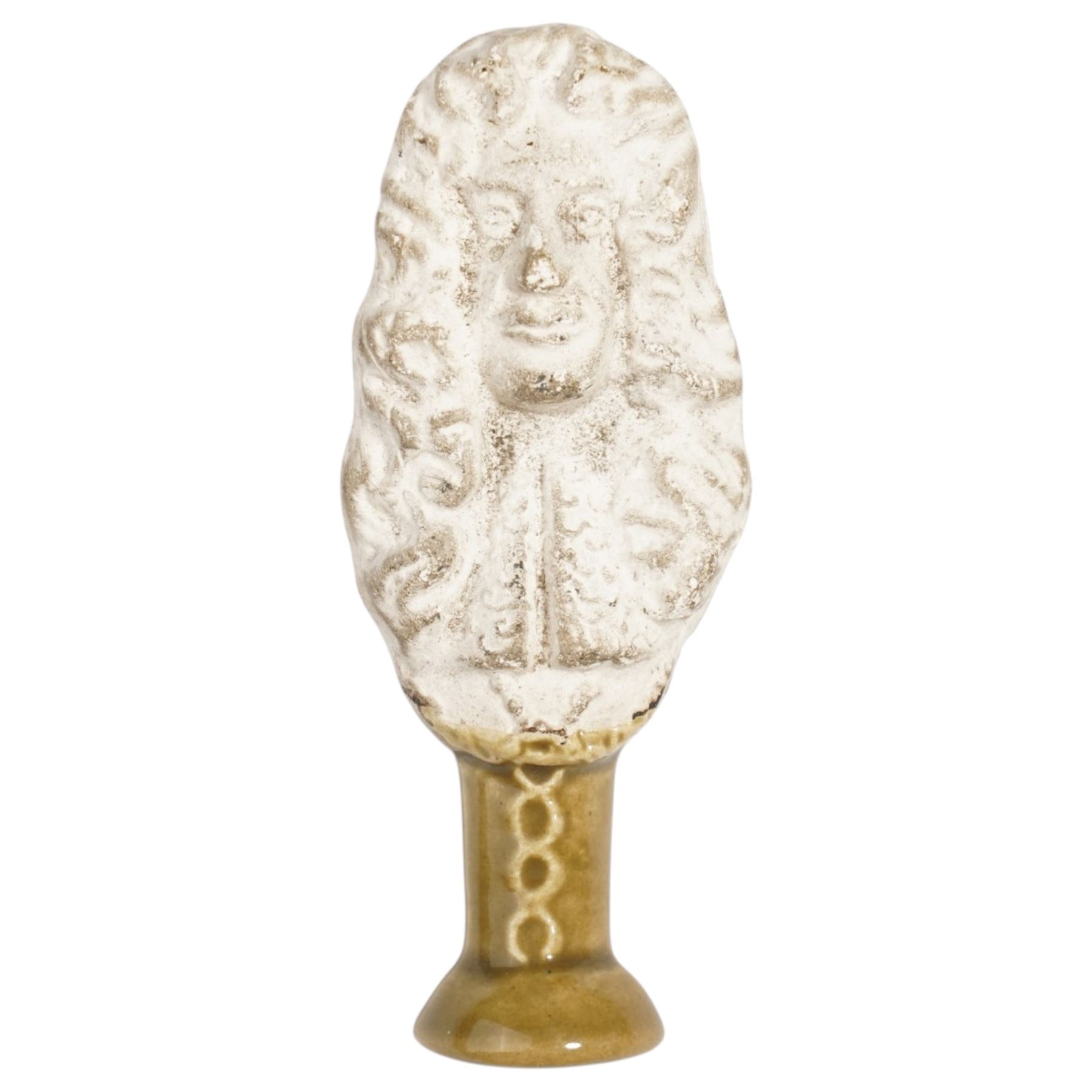 Mid 19th century biscuit porcelain pipe tamper depicting King Charles II, with glazed lower section, marked CRII to reverse, H6cm