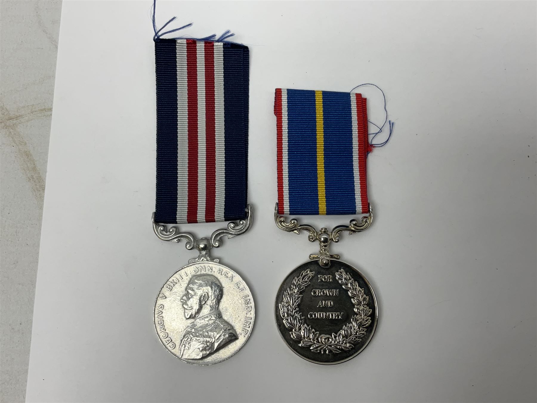Gaunt & Son Territorial Force Nursing Service cape medal; cased; WW1 British War Medal and 1914-15 Star (names erased); two MID oak leaves; Polish and American medals; eight replica medals including VC, MM, Air Crew Europe Star etc and replica group of five WW2 miniatures etc