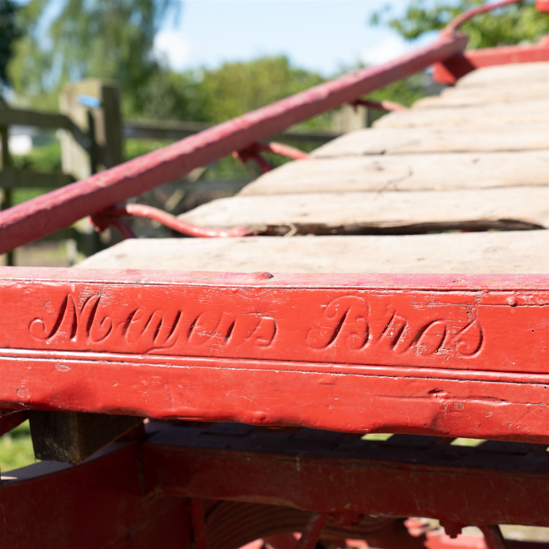 Costermonger’s Cart

A painted costermonger’s cart with red timber frame, slatted deck and wooden spoked wheels. The cart has long hand rails, raised side rails and turned supports, with incised inscriptions to the frame, including “Meyers Bros”. The form is consistent with a hand drawn market cart, used for carrying and displaying produce or goods.

Features:
Red painted timber frame
Slatted wooden deck
Wooden spoked wheels
Long hand rails
Raised side rails
Turned timber supports
Incised inscriptions to the frame
“Meyers Bros” inscription visible
Traditional market cart form

Dimensions:
Length: 240 cm (body approximately 210 cm)
Width: 102 cm
Height: 92 cm

Wheel diameter: 67 cm