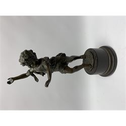 After E Plat, bronze modelled as a dancing child, signed E. Plat, upon cylindrical black marble base, H40cm