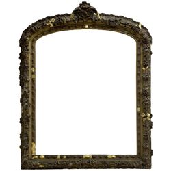 19th century giltwood and gesso moulded picture or mirror frame, the arched cresting rail mounted by central cartouche decorated with foliate scrolls and fruit, the outer frame decorated with scalloped edge and shell mouldings, trailing foliage with flower head and fruit to the central band, egg and dart moulded inner slip