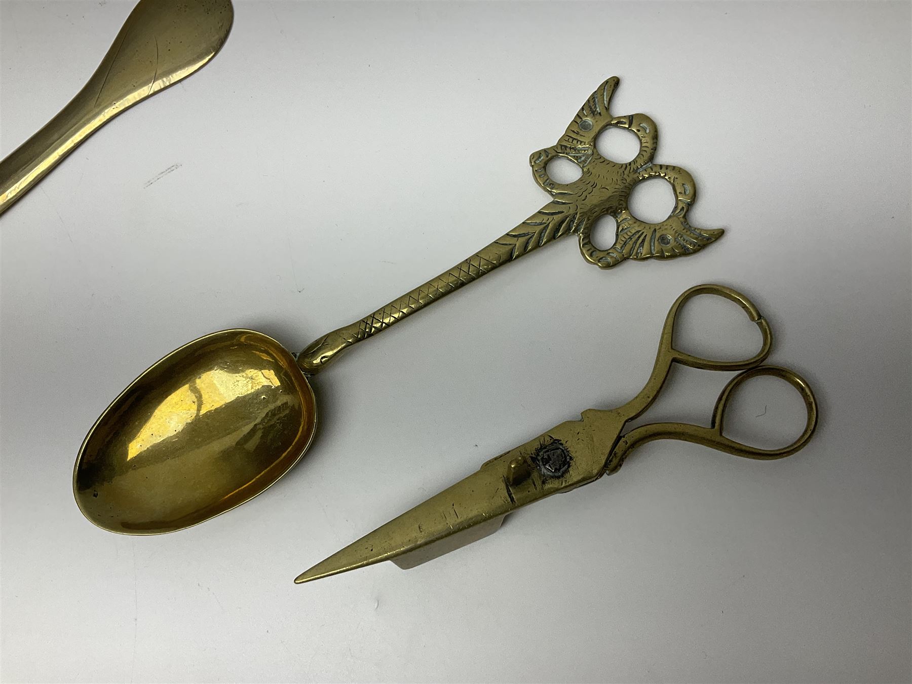 George III oak spoon rack and candle box, the rectangular backplate with shaped  pediment and two six aperture spoon racks, above a candlebox with hinged cover, with various brass spoons and a pair of brass candle snuffers, H56.5cm, W35cm, D14cm 