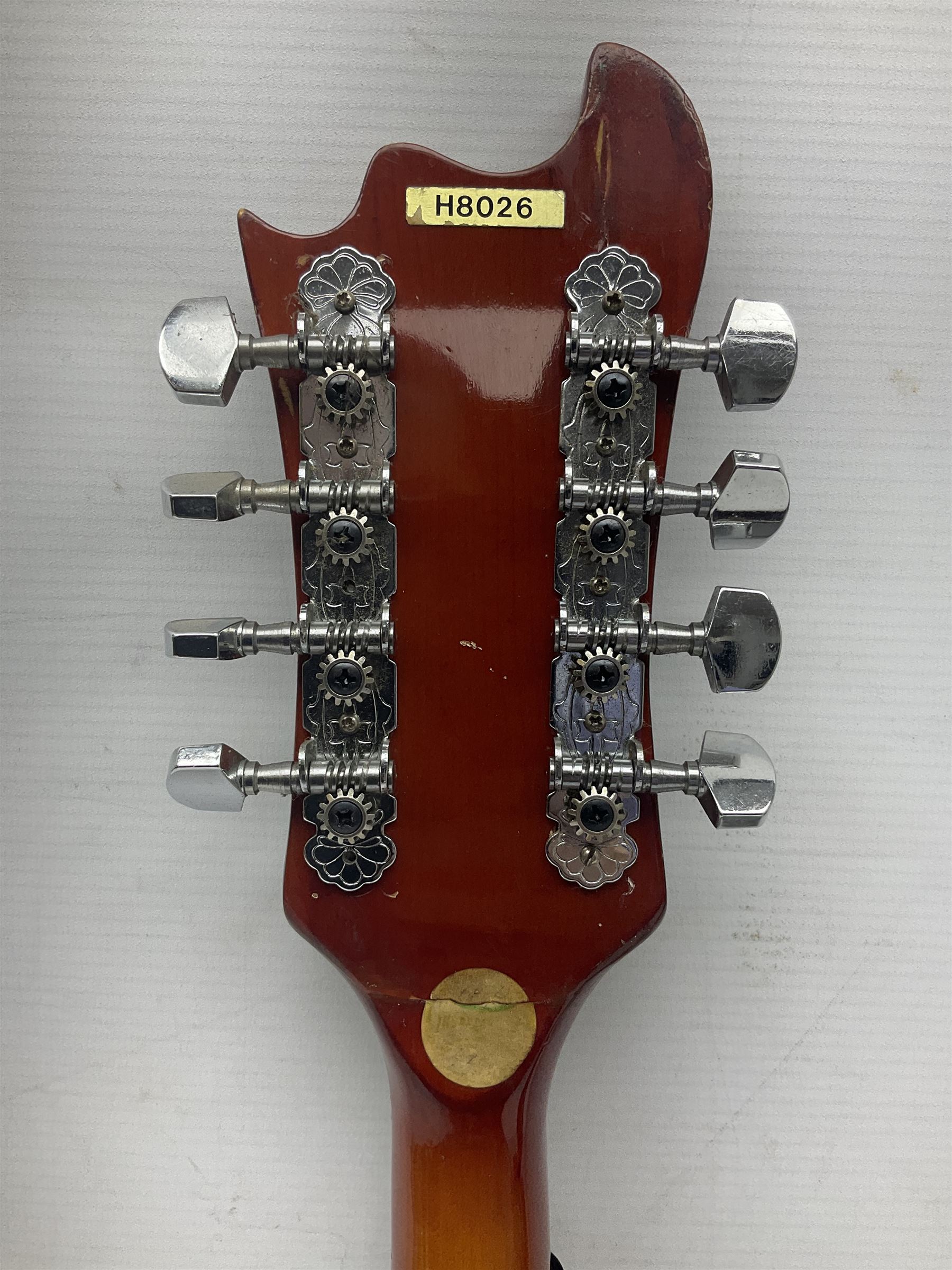 Eastern eight-string mandolin with sunburst finish and mother-of-pearl inlay L68.5cm; and another Harmony mandolin with cracked headstock (2)