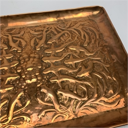 Newlyn School copper tray of rounded oblong form embossed with a shoal of fish swimming amongst bubbles and seaweed W38cm