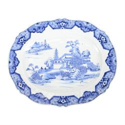 19th century Cantonese plate of octagonal form decorated to the centre with a garden of flowering peonies, together with two other 19th century plates and two serving platters each depicting temples in landscapes, octagonal plate W31cm  