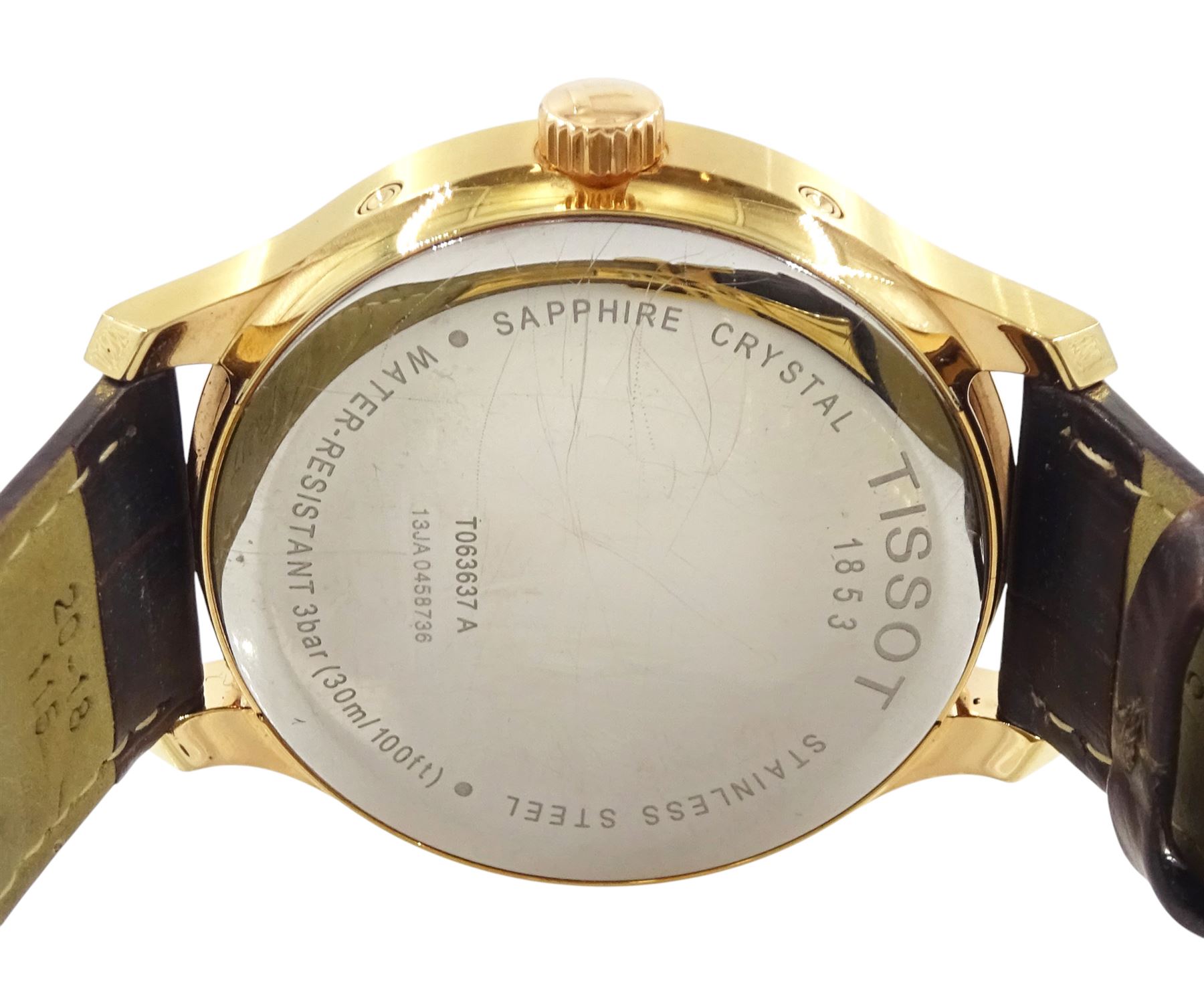 Tissot Tradition Perpetual Calendar gentleman's gold-plated and stainless steel quartz wristwatch. Ref. T063637 A, silvered dial with dagger hour markers and Arabic 12 o'clock, on original brown leather strap, with fold-over clasp, cased and boxed with additional parts