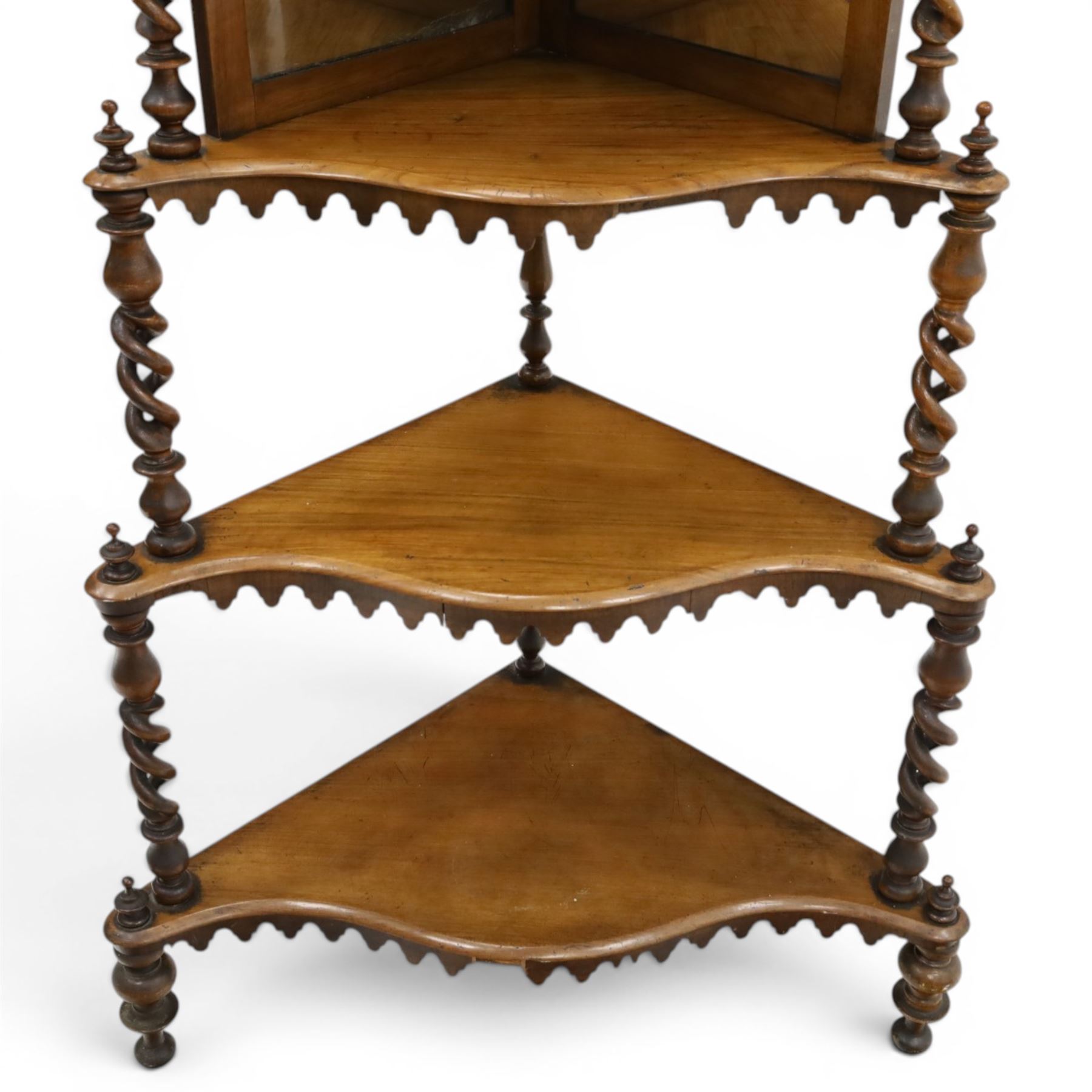 Victorian mahogany five-tier corner whatnot, raised and pierced back of scrolling foliate design, over two tiers with mirror backs and pear-drop moulded aprons, united by pierced spiral-turned uprights, on turned feet