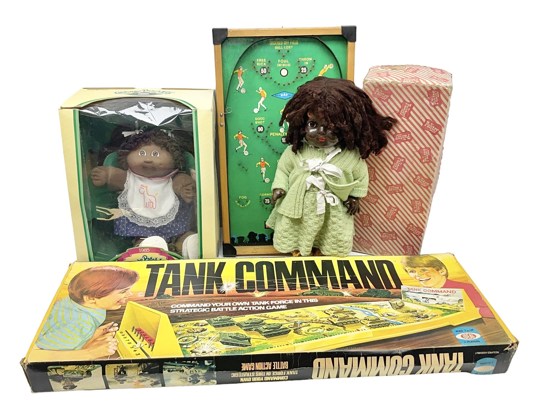 Ideal 'Tank Command' battle action game; boxed; Kay 'Pin Football' bagatelle game; Coleco Cabbage Patch Kids 'Carita Aleen' doll; boxed with certificate; and Palitoy composition head and body doll; boxed (4)