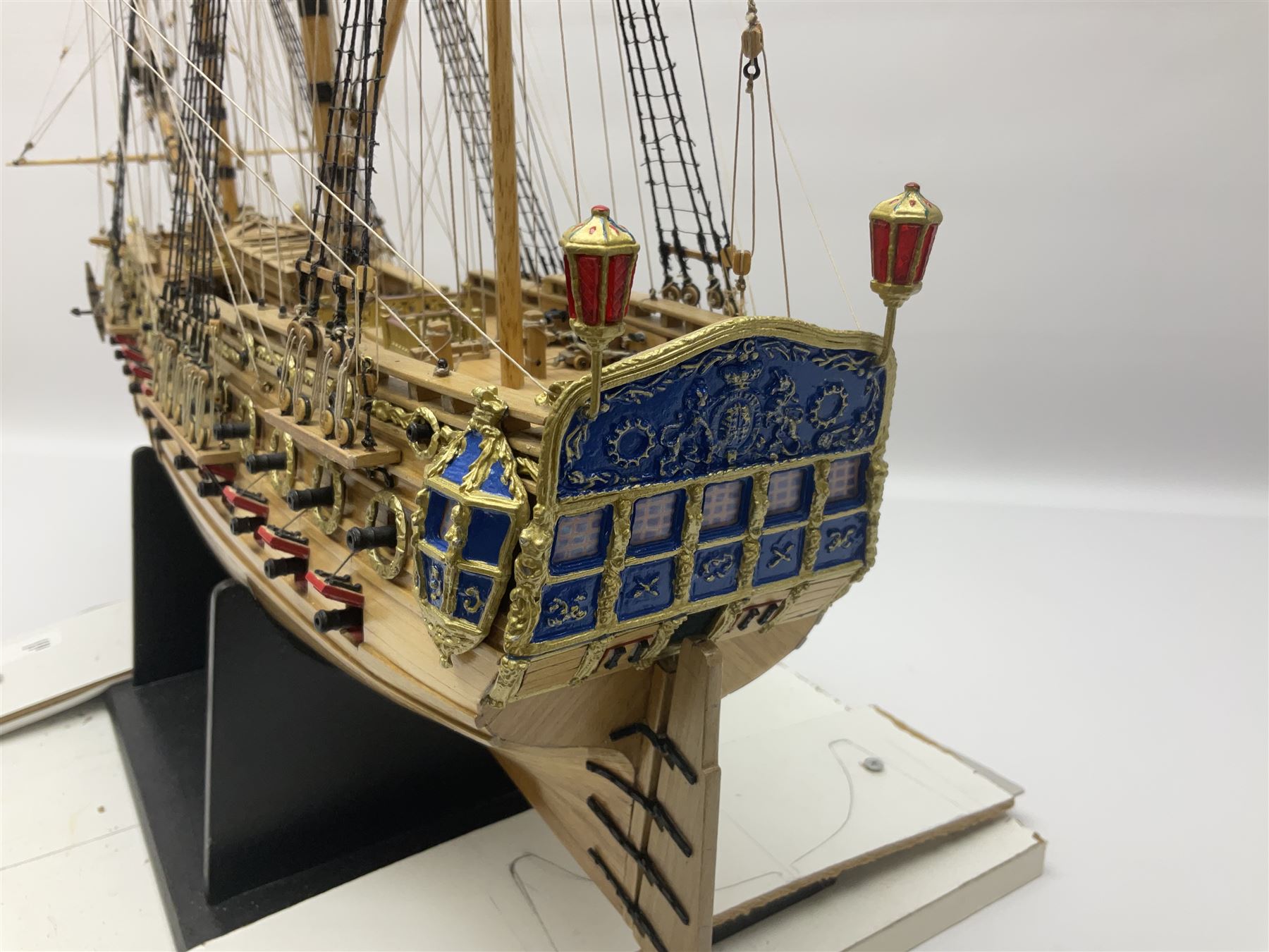 Wooden kit built model of HMS Neptune, 1:90 scale, with detailed rigging to three masts and a row of cannons to either side, upon ebonised wooden base, including stand H71cm