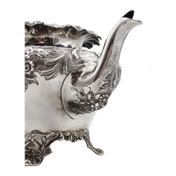 Victorian silver teapot, embossed floral and foliate decoration on four scroll feet by Martin, Hall & Co, London 1887, approx 26oz