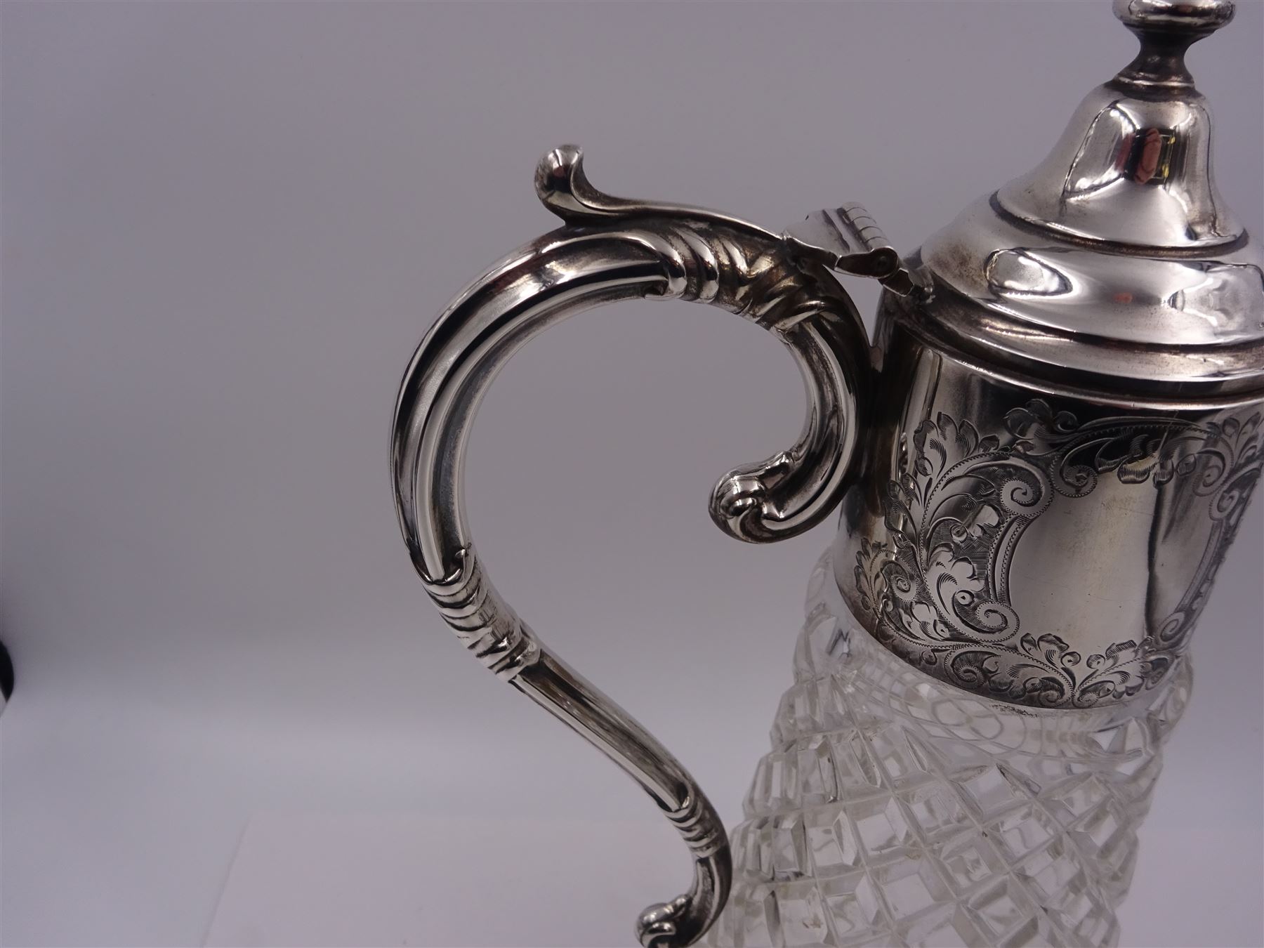 Modern silver mounted glass claret jug, with capped C scroll handle, engraved collar and urn finial to cover, hallmarked Charles S Green & Co Ltd, Birmingham 1973, H32.4cm