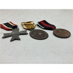 Three WW2 German medals - Defences Medal, Czech Occupation Commemorative Medal and War Merit Cross; all with ribbons (3)