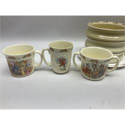 Royal Doulton Bunnykins nursery wares, including twin handled mugs, bowls, plates (17) 