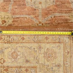 Afghan Ziegler rug, terracotta field with an all-over design of palmettes and stylized foliage in soft beige and gold tones, with a Persian Qum silk prayer rug, with a central tree of life and flowering branches and birds, within multiple floral borders, 88x125cm (2)