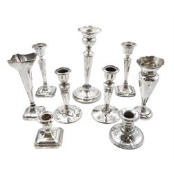 Two pairs of silver candlesticks, three others, two silver vases, silver bottle lids, all hallmarked, silver coin dish and a bon bon dish stamped 800