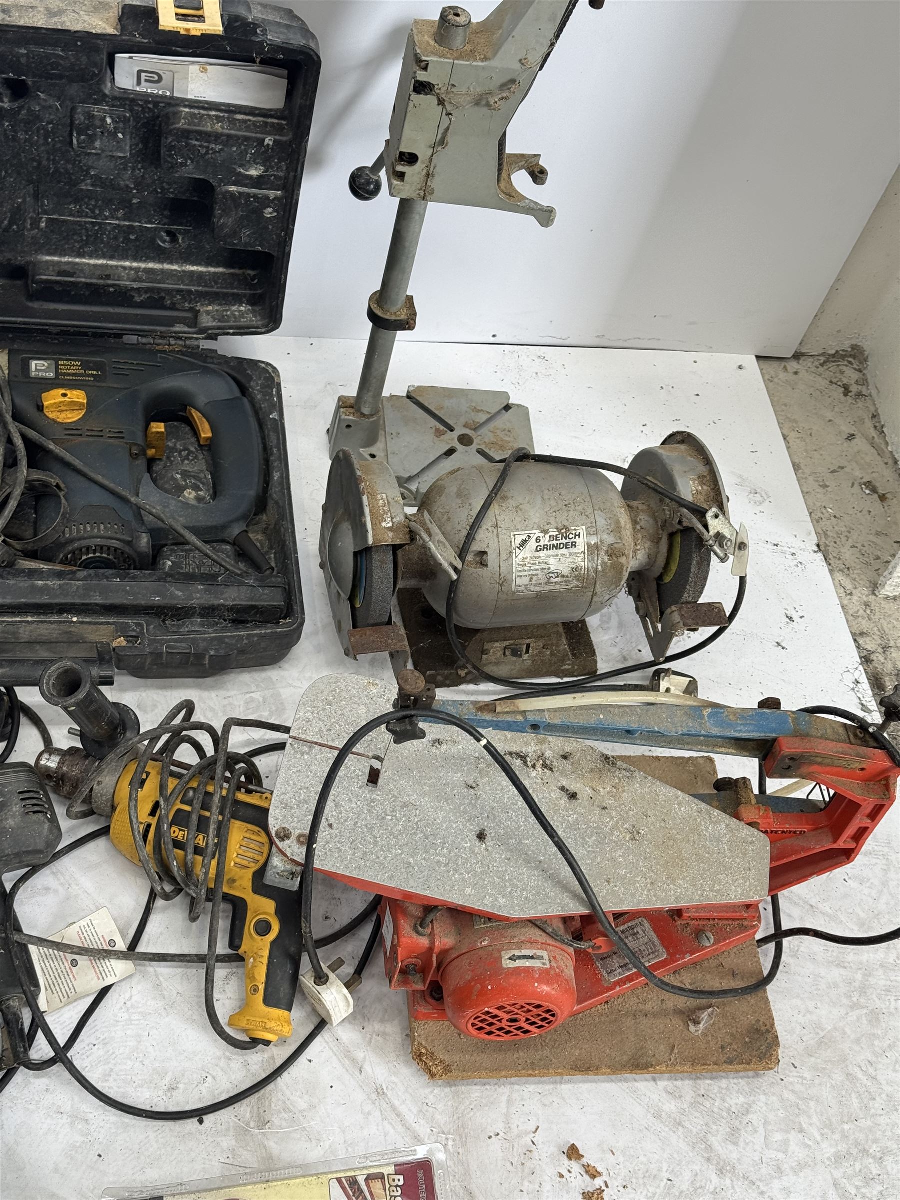 Performance Pro router with accessories, cased; DeWalt drill, two angle grinders with bits, biscuit jointer, bench grinder, scroll saw, heat gun, drills and other