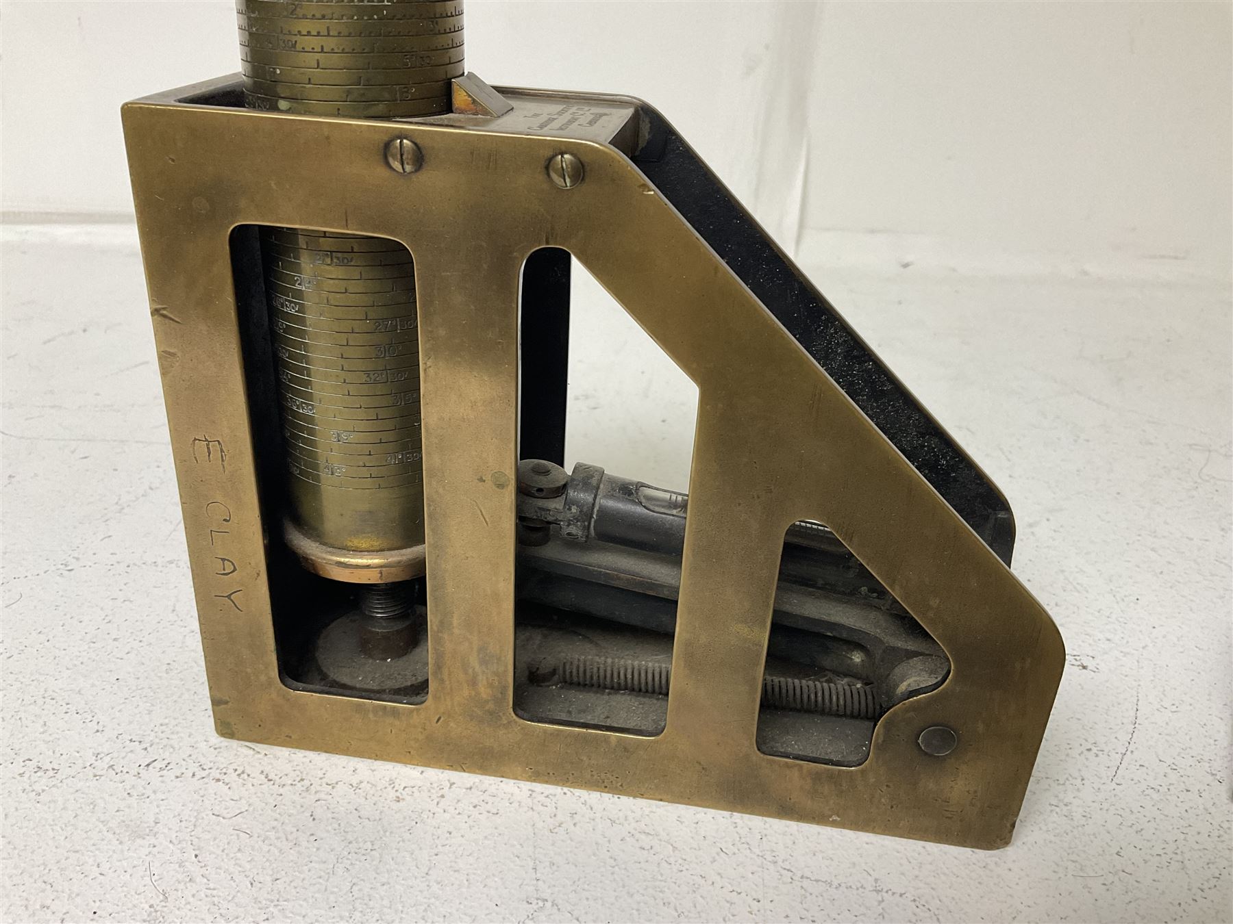 Cambridge Scientific Instruments Co clinometer, flintlock tinder lighter, and a Anders Mattson Mora patent bobbin winder (3)