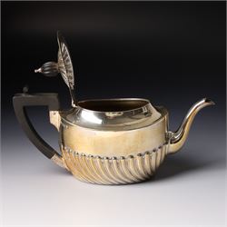 Late Victorian bachelors silver tea set of oval form with half body decoration, the teapot with ebonised handle and lift Sheffield 1895 Maker Harrison Bros. & Howson