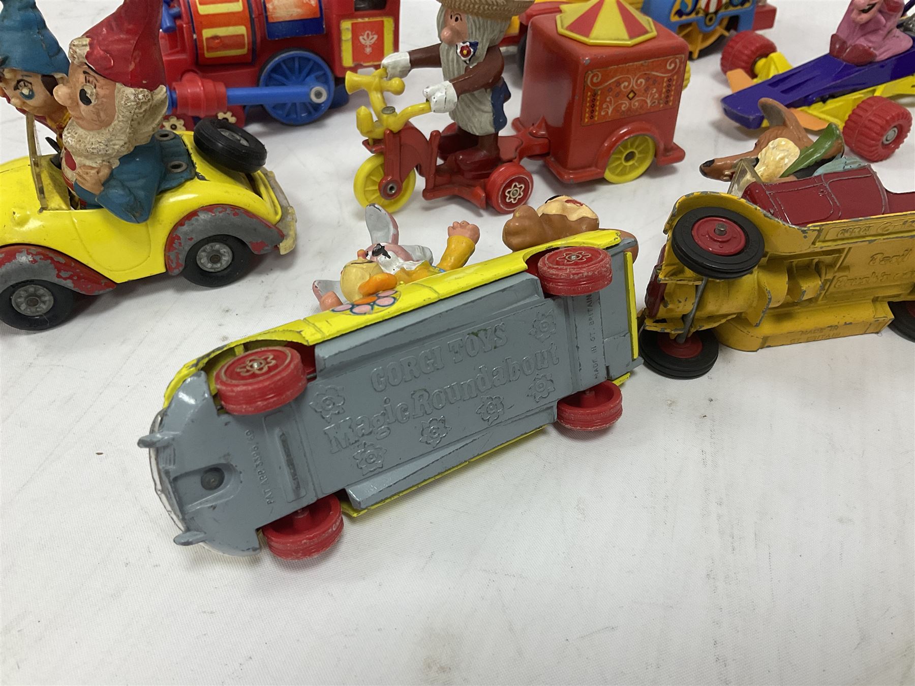 Corgi/Dinky - twelve unboxed and playworn TV/Film related die-cast models including Popeye Paddle Wagon; Dick Dastardly; Magic Roundabout; Muppets; Basil Brush; and Noddy (12)